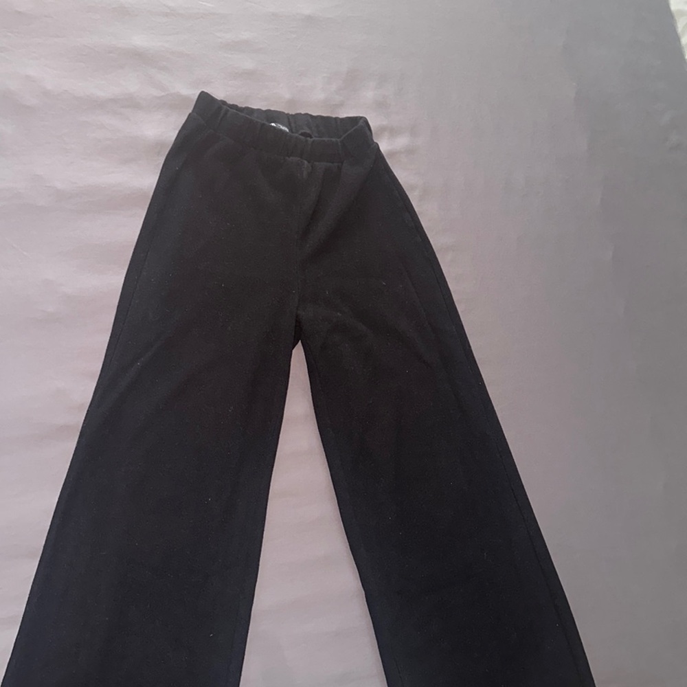 Black dressy flared women’s pants.